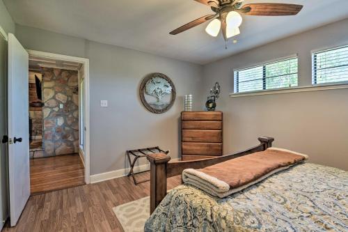 a bedroom with a bed and a ceiling fan at Bay Access and Dock Riverfront Tivoli Escape in Tivoli
