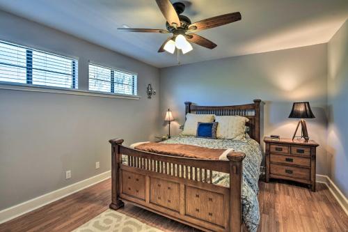 a bedroom with a bed and a ceiling fan at Bay Access and Dock Riverfront Tivoli Escape in Tivoli