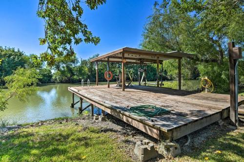a wooden dock with a gazebo next to a lake at Bay Access and Dock Riverfront Tivoli Escape in Tivoli
