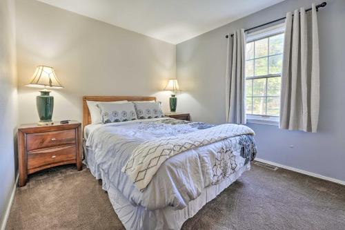 a bedroom with a bed and a window at Hedge House Just 4 miles to Notre Dame! in Granger