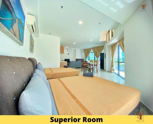 a living room with a bed and a couch at Sweet Tree Homestay Petaling Jaya in Petaling Jaya