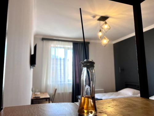 a vase sitting on a table in front of a mirror at Sargsyan ECO house in Sevan