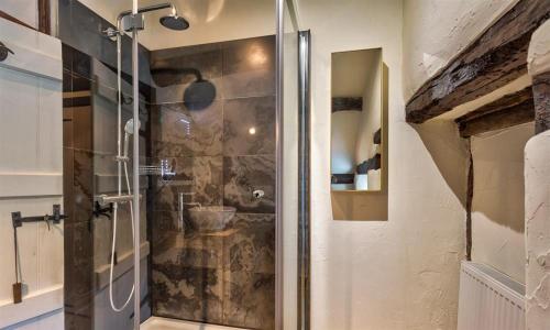 a shower with a glass door in a bathroom at Fair Rigg Old Farm in Cartmel