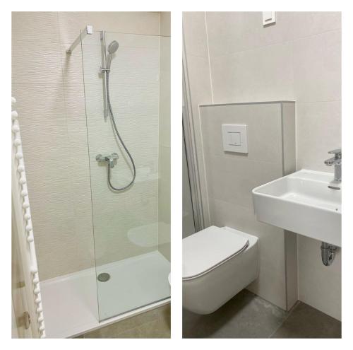 uma casa de banho com um chuveiro, um WC e um lavatório. em Arena ZG Apartment em Zagreb