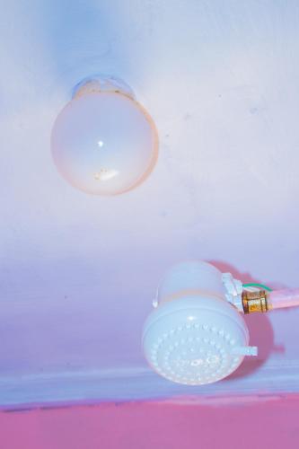 a light hanging from a ceiling next to a table at Secure Standalone 3BR Home near Embu Uni and KSG in Embu