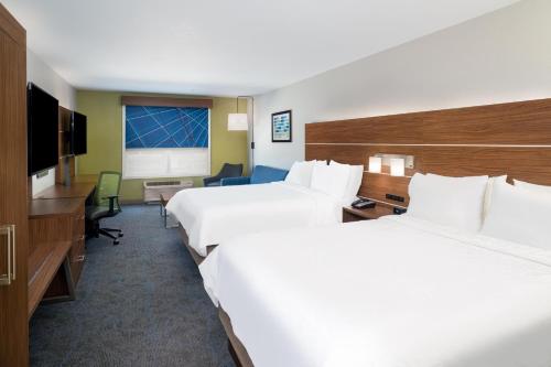 a hotel room with two beds and a television at Holiday Inn Express & Suites - Dahlonega - University Area by IHG in Dahlonega