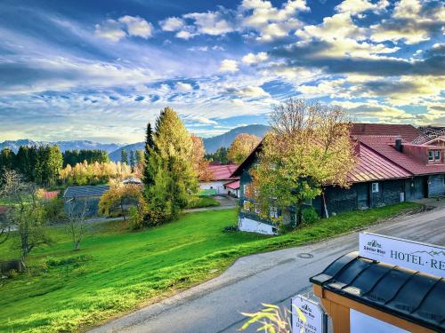 an empty road in a small village with a hotel premises at Hotel Bergstätter Hof in Immenstadt im Allgäu