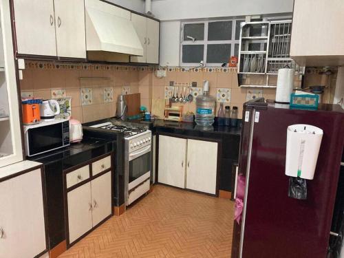 Køkken eller tekøkken på Crimson Apartment