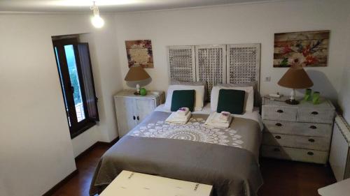 Ein Bett oder Betten in einem Zimmer der Unterkunft Quinta do Cavaleiro ao Sol - um lugar ao sol