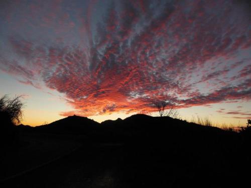a sunset with a colorful sky in the background at Caserio Los Partidos in San Jose De Los Llanos