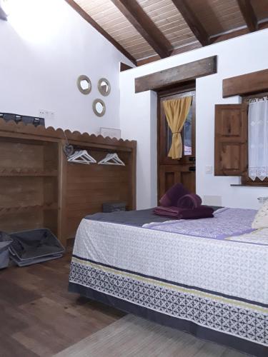 a bedroom with a bed in a room at Casa Marcelo in Proaza