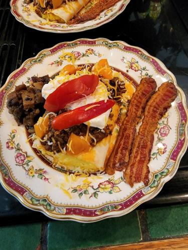 a plate of food with meat and vegetables on it at House of 1833 Bed and Breakfast in Mystic