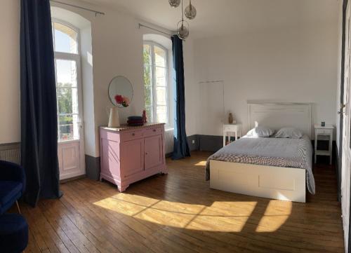 Postel nebo postele na pokoji v ubytování MAISON DE CHARME