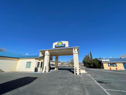 a gas station with a sign on top of it at Days Inn by Wyndham Deming in Deming
