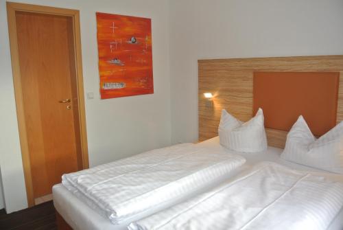 Postel nebo postele na pokoji v ubytování Hotel Art-Ambiente