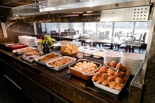 a buffet line with many different types of food at Arena Copacabana Hotel in Rio de Janeiro