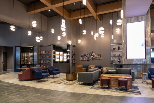 a lobby with couches and chairs and a waiting room at Hollywood Casino at Greektown in Detroit