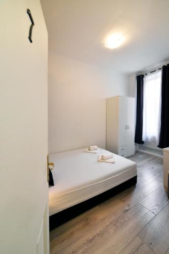 a bedroom with a bed in a room at Virtus Apartments and Rooms with Free Private Parking in Zagreb