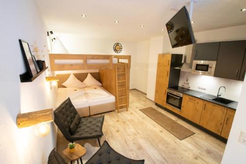 a small apartment with a bed and a kitchen at W-Spirit Apartments in Jerzens