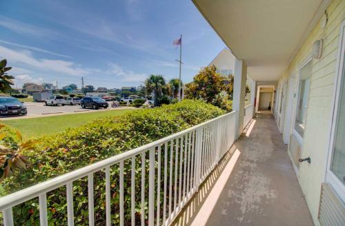 a balcony of a house with a view of a parking lot at Villas of Hatteras Landing by KEES Vacations in Hatteras
