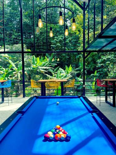 a pool table with balls on top of it at The Scarlet Villas in Ojochal