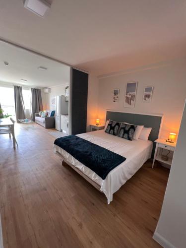 a bedroom with a large bed in a room at Las vistas Sea View Apartment terraza & playa 3 min in Morro del Jable