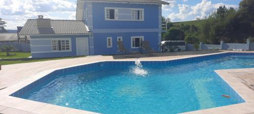 A piscina localizada em POUSADA BLUE GARDEN ou nos arredores