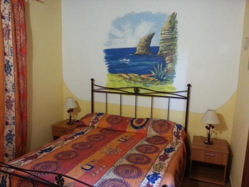 Un pat sau paturi într-o cameră la Il Sole Di Lampedusa