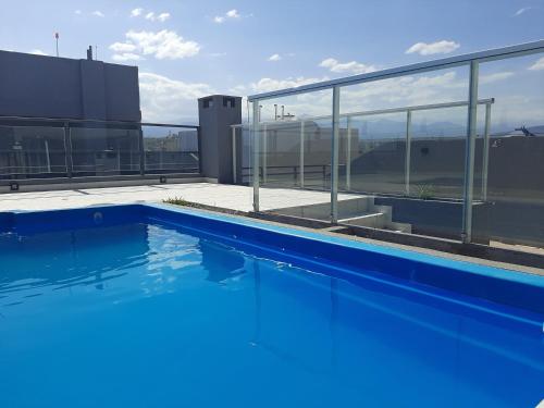 a swimming pool on the roof of a building at DEPARTAMENTO LA GAVIOTA in Salta