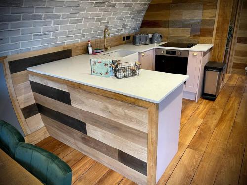 a kitchen with a sink and a counter top at Rabbits View in Rhayader