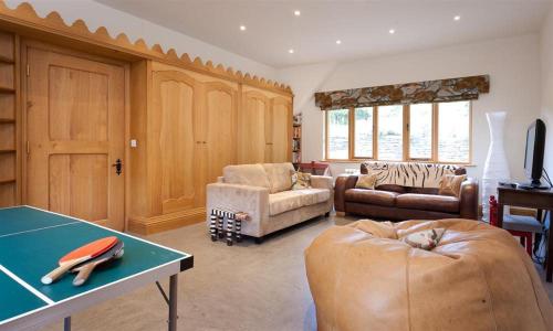 a living room with a ping pong table at The Old Coach House in Troutbeck
