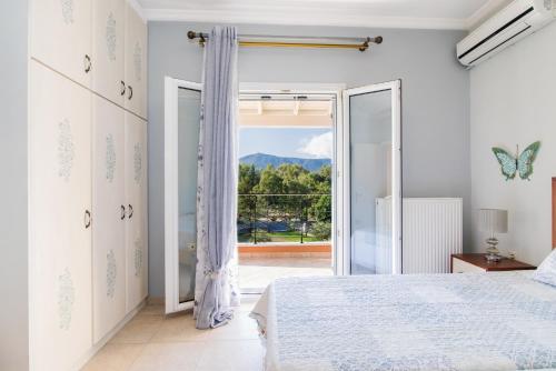 Ένα ή περισσότερα κρεβάτια σε δωμάτιο στο VILLA ALEXANDRA