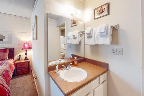 a bathroom with a sink and a bed at Sherwin Villas 12 B in Mammoth Lakes