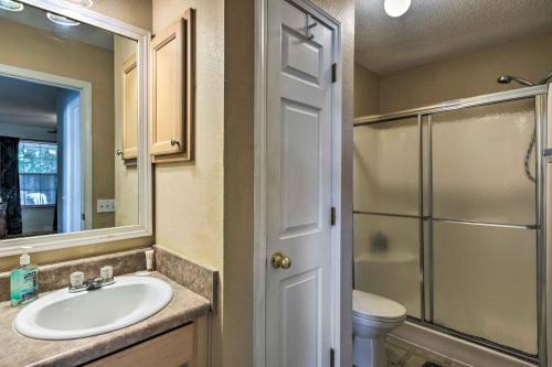 a bathroom with a sink and a shower at Cute Pensacola Townhome about 9 Mi to Downtown! in Pensacola