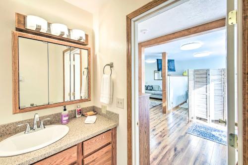 a bathroom with a sink and a mirror at Cozy Cottage Studio Stunning Mountain Views! in Hamilton