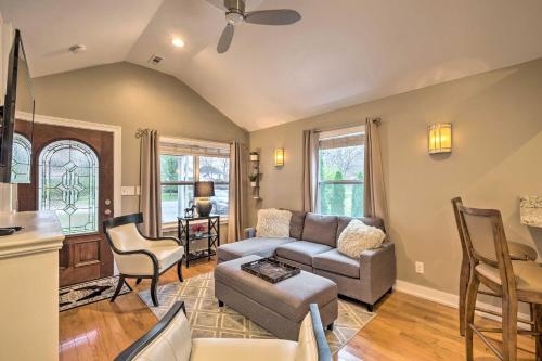 a living room with a couch and a table at Luxe Lyndon Home Less Than 11 Mi to Dtwn Louisville! in Louisville