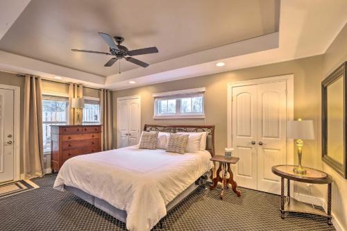 a bedroom with a bed and a ceiling fan at Luxe Lyndon Home Less Than 11 Mi to Dtwn Louisville! in Louisville