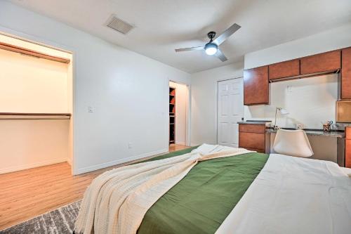 a bedroom with a large bed and a kitchen at Private Pools and Hot Tubs Luxe Brandon Oasis! in Brandon