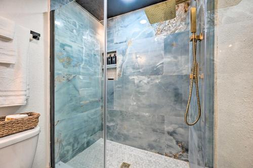 a shower with a glass door in a bathroom at Cozy Brandon Guest Studio with Pool and Hot Tub! in Brandon