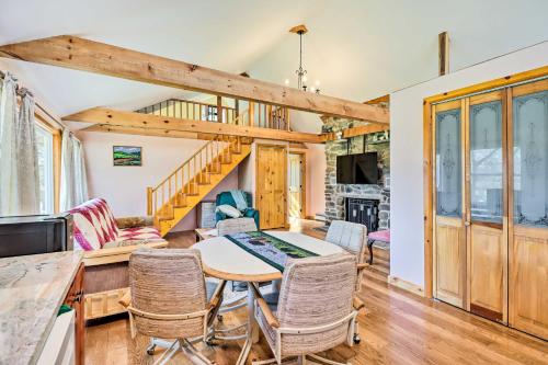a dining room and living room with a table and chairs at Cozy Tannersville Gem - Ski, Hike, Explore! in Tannersville