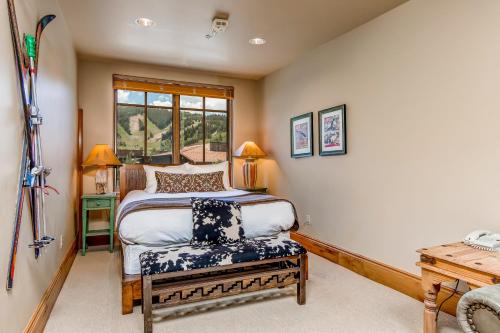 a bedroom with a bed and a bench in it at The Lodges at Deer Valley C 5423 in Park City