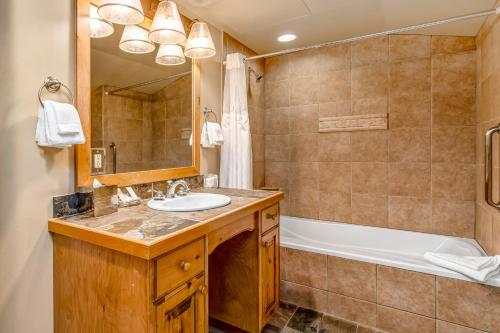 a bathroom with a sink and a tub at The Lodges at Deer Valley C 5423 in Park City