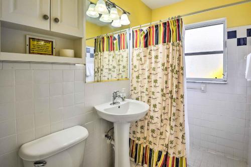a bathroom with a sink and a shower curtain at Nokomis Home with Gas Grill 2 Blocks to Beach! in Nokomis