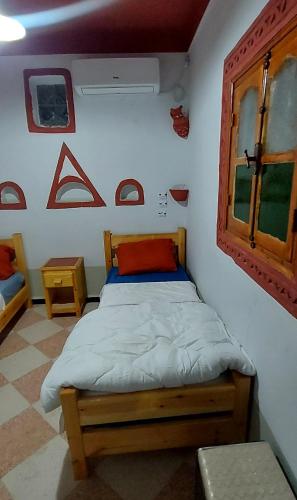 Postel nebo postele na pokoji v ubytování Dar Agham Akbou