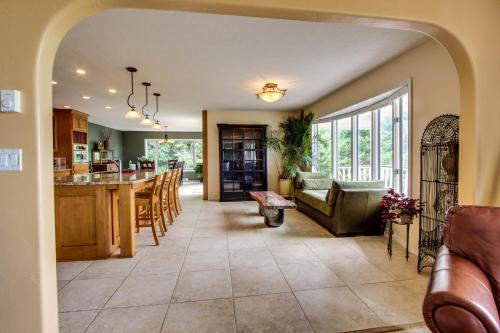 a kitchen and living room with a couch and a table at Hidden Luxury Beachfront Estate in Yachats