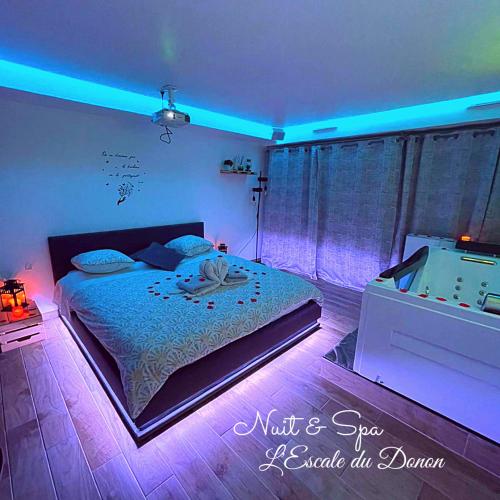 Katil atau katil-katil dalam bilik di L'escale du Donon "Le Jardin Secret"