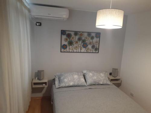 En eller flere senge i et værelse på Ensueño