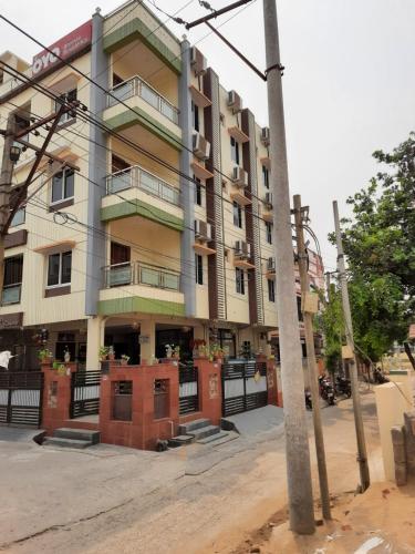 a building on the corner of a street at Bhimas Residency in Kurmannapalem