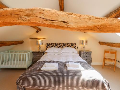 a bedroom with a large bed with two pillows at The Low House in Kendal