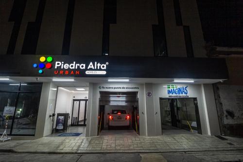 a car is driving into a parking garage at night at Hoteles Piedra Alta by De Los Perez in San Andrés Tuxtla